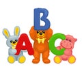 There are plush bear, bunny, panda and hippo holding letters Royalty Free Stock Photo